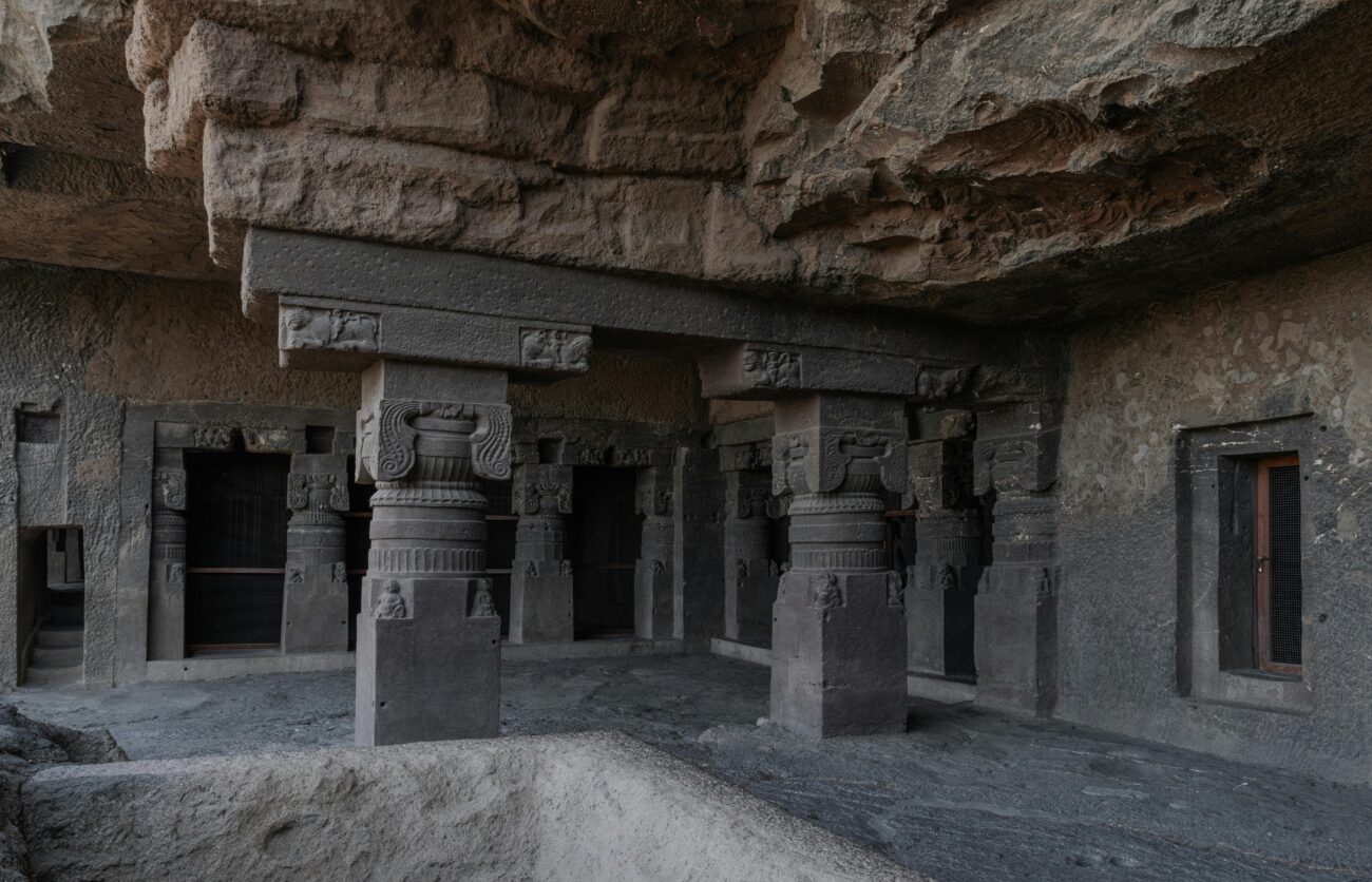 Ajanta & Ellora Caves’ intricate rock-cut carvings and frescoes under Maharashtra’s Deccan sky