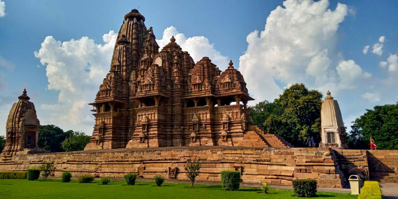 Khajuraho’s Kandariya Mahadeva Temple with intricate carvings under a golden Madhya Pradesh sky