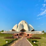 Lotus Temple’s white marble petals illuminated at dusk in Delhi