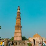 Qutub Minar’s towering sandstone structure with intricate carvings in Delhi