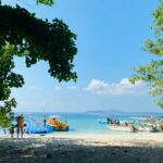 Radhanagar Beach’s white sands and turquoise waters under a vibrant Andaman sky