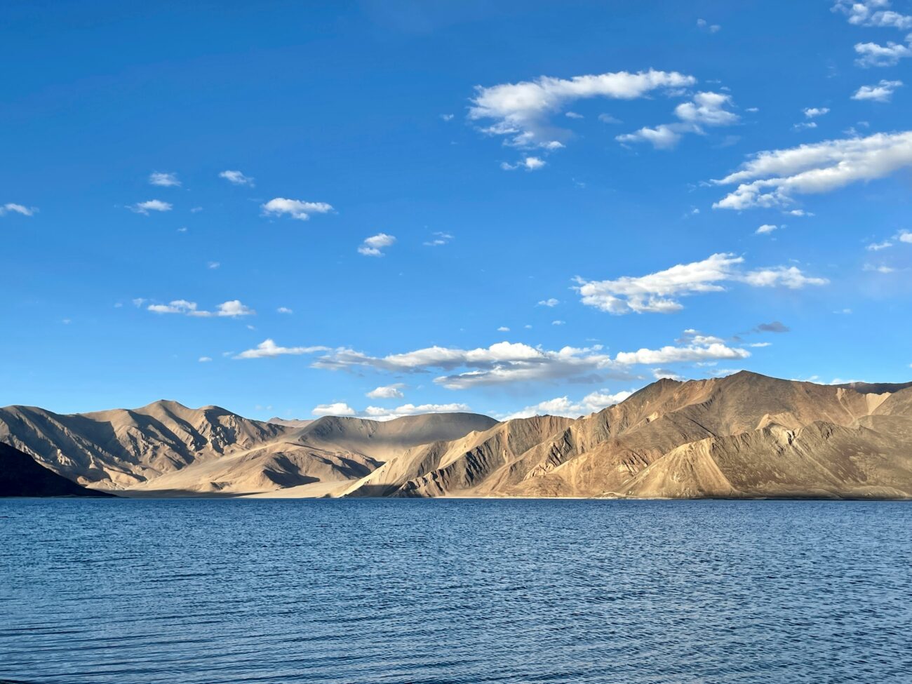 Vibrant blue waters of Pangong Lake with Himalayan backdrop